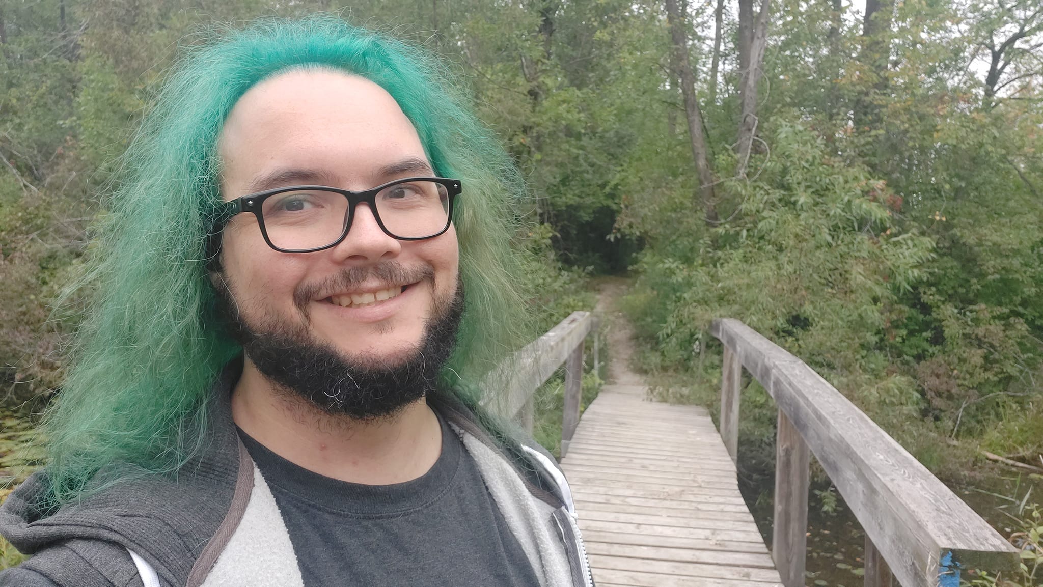 A man with green hair is visiting a freshwater marsh, photo 18